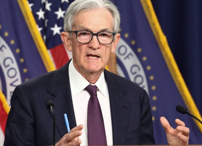 Fed leaves rates unchanged, defying Trump's demands for aggressive cuts