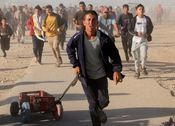 Starving Palestinians pepper-sprayed at GHF aid site in Gaza, video shows | Israel-Palestine conflict News