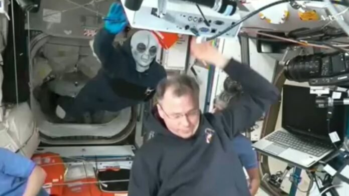 Russian cosmonaut Ivan Vagner wears alien mask while welcoming newcomers 23 alien mask 2