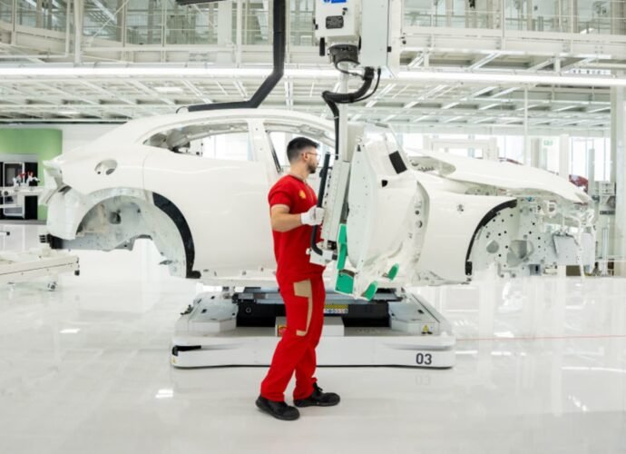 Ferrari unveils first electric vehicle and cuts 2030 EV sales target