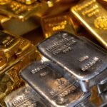 Gold and silver extend losses as oscillating oil prices spark market volatility