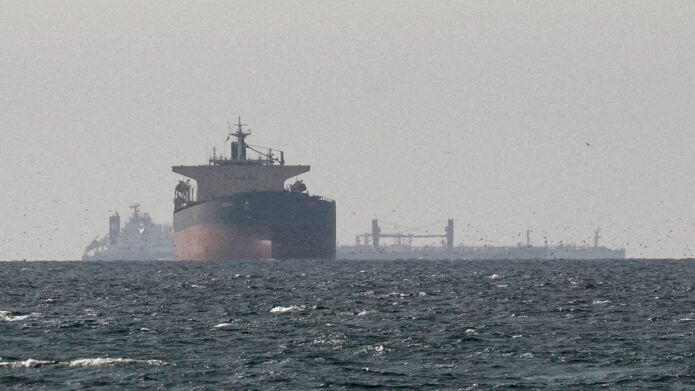 Iran says talks continue while it retains control of Strait of Hormuz